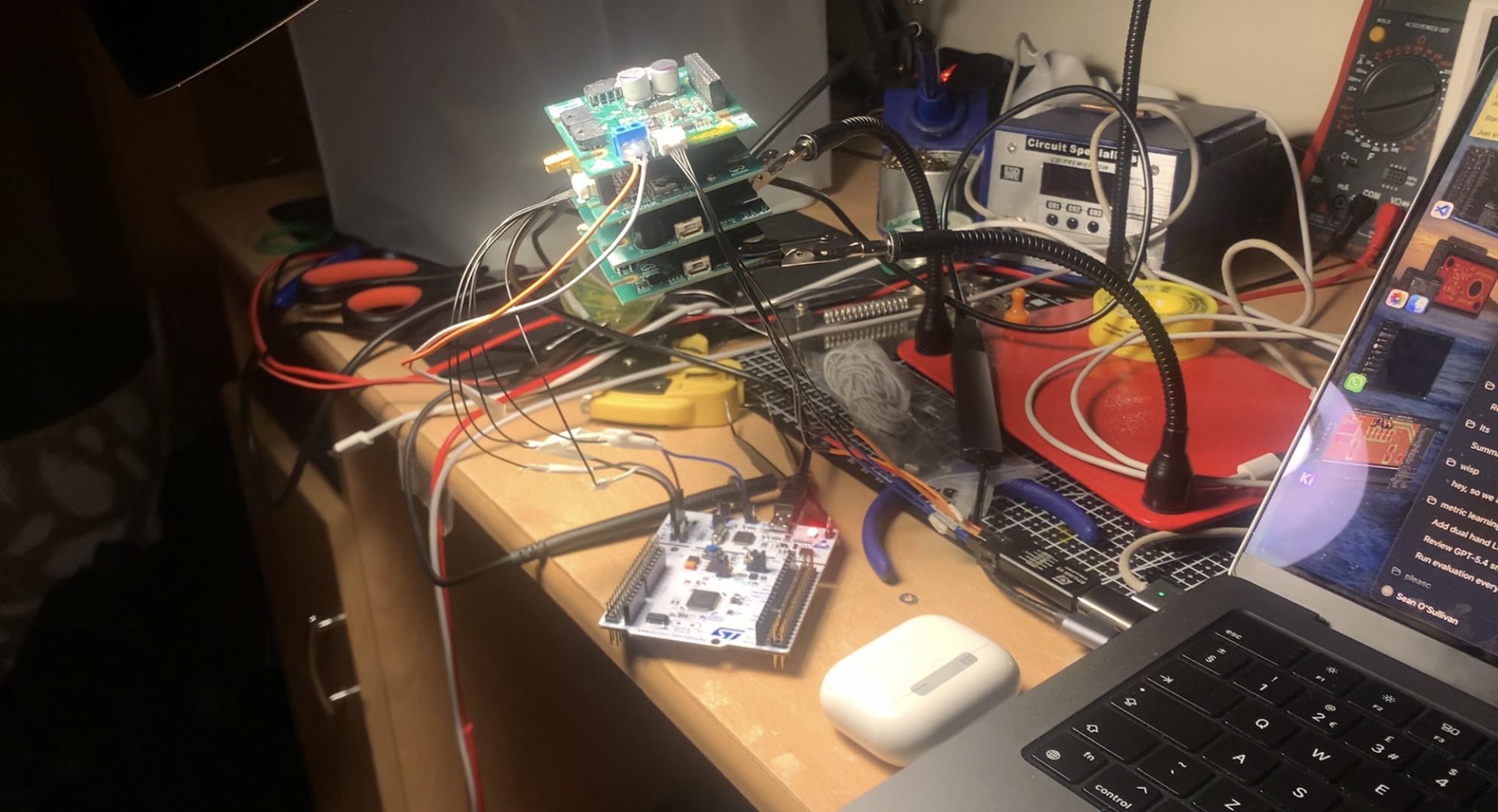 Two Ogma boards connected to two STLinks during distributed hardware-in-the-loop testing