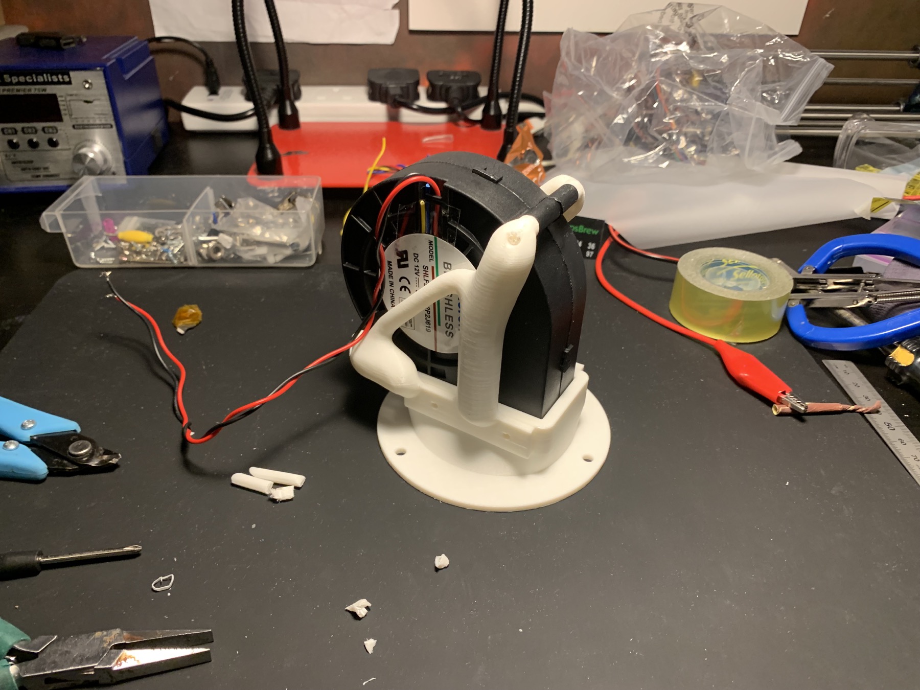 Industrial centrifugal blower held in the white printed generative bracket