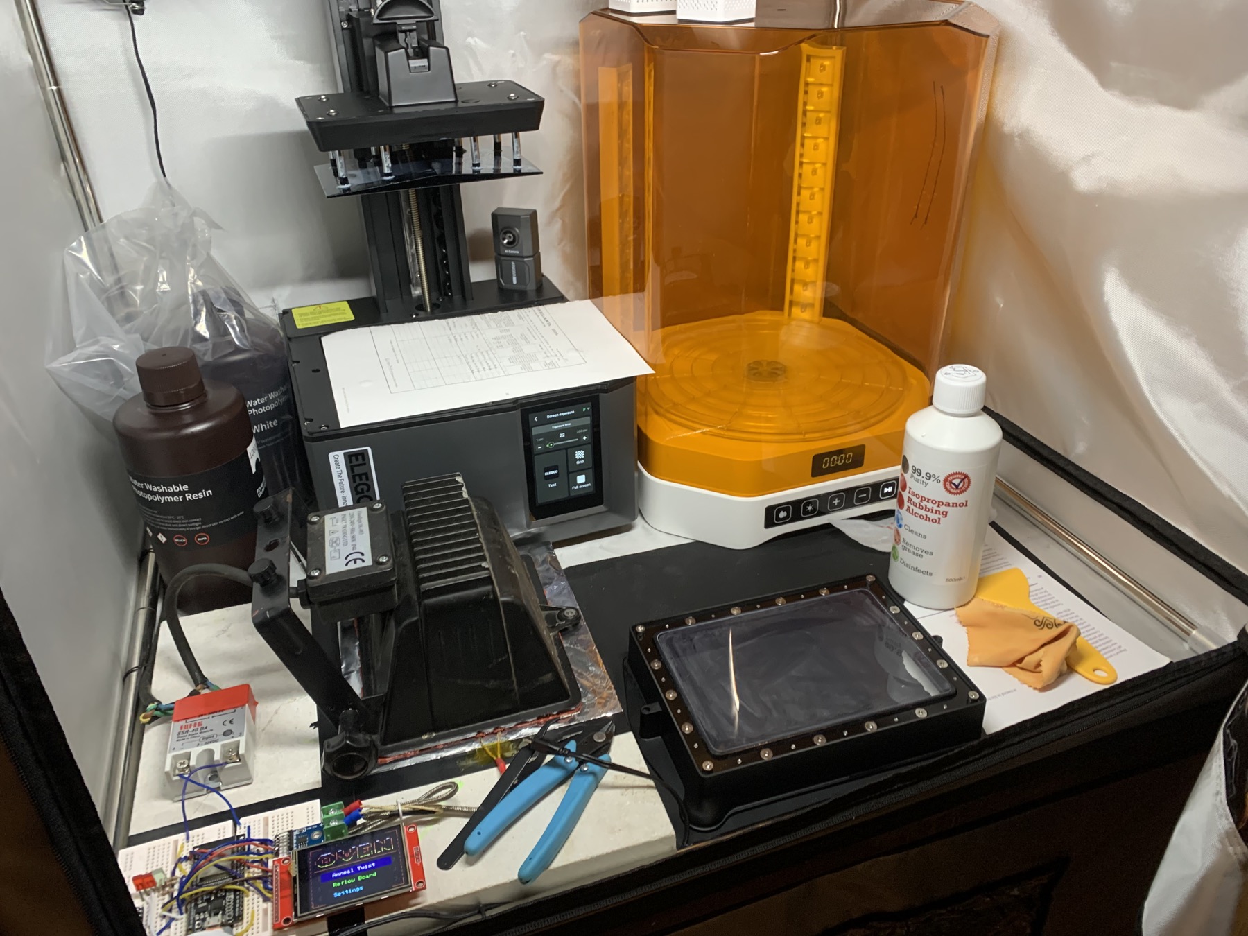 Resin-print cleaning tools and curing station arranged inside the enclosure