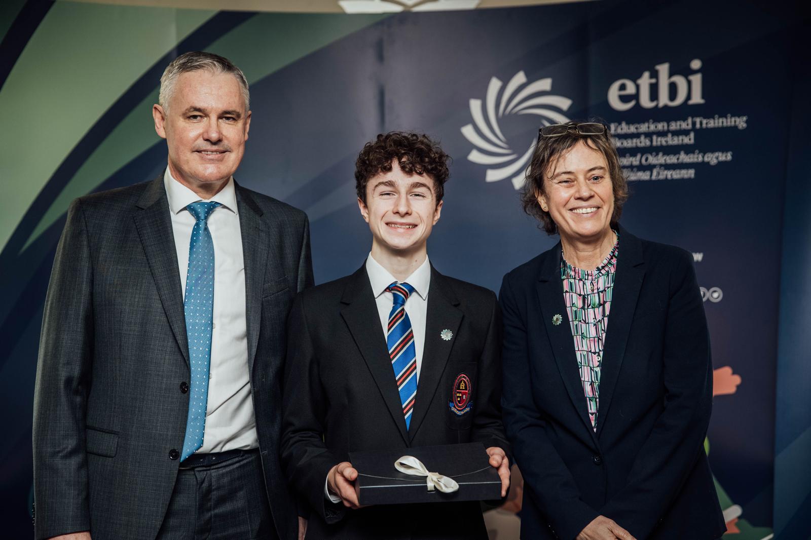 Seán receiving a presentation at an Education and Training Boards Ireland event